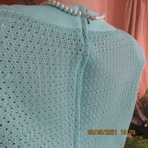 High quality vintage dress by MARCHESA from DELSWA size 42/18 in aquamarine crimplene.As new