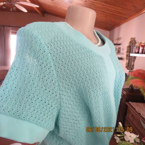 High quality vintage dress by MARCHESA from DELSWA size 42/18 in aquamarine crimplene.As new