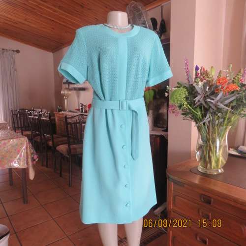 High quality vintage dress by MARCHESA from DELSWA size 42/18 in aquamarine crimplene.As new