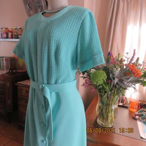 High quality vintage dress by MARCHESA from DELSWA size 42/18 in aquamarine crimplene.As new