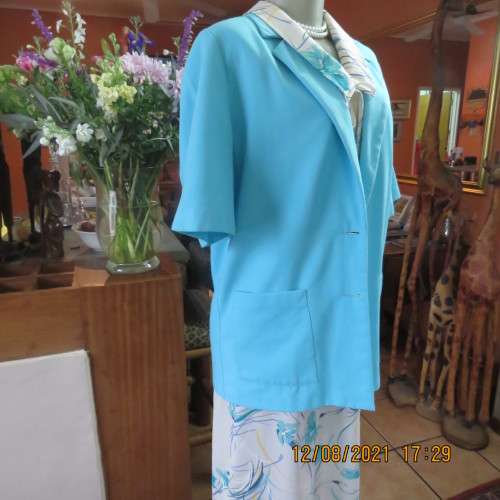 Classic skyblue short sleeve jacket by DELSWA size 36/38. Large front pockets. Button down.As new.