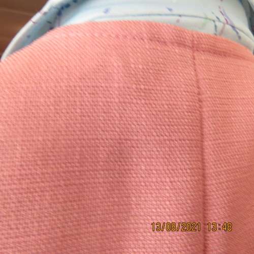 Sleeveless rosepink open jacket in size 34 to 36.