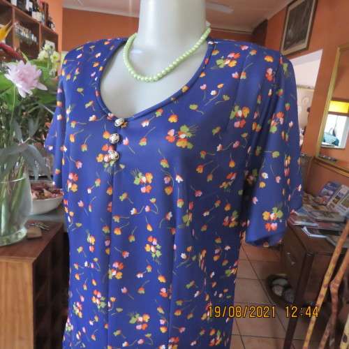Vintage boutique shift dress. Royal blue with orange/pink and lime green flowers.Size 42/18.As new