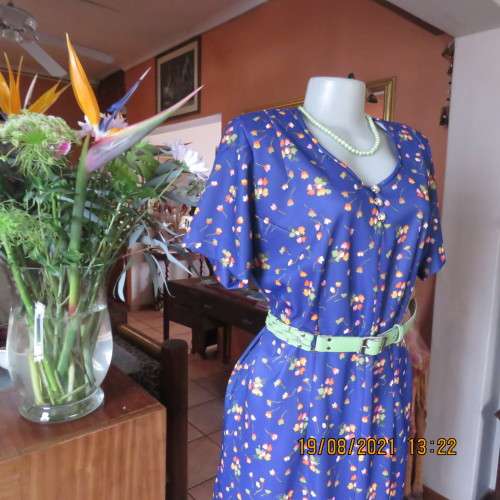 Vintage boutique shift dress. Royal blue with orange/pink and lime green flowers.Size 42/18.As new