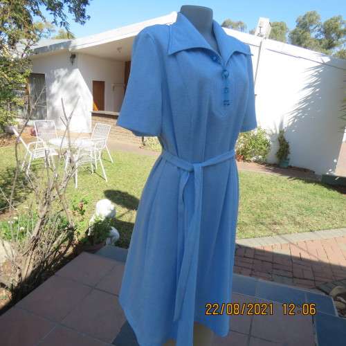 As new  80`s vintage dress in sky blue mottled look by PRINCESS size 44/20. Lapel collar. With belt.