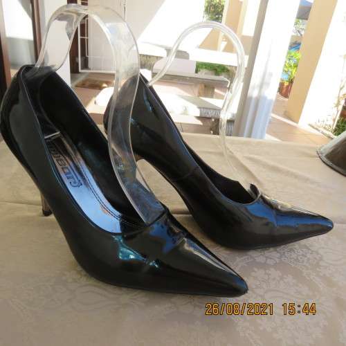 Pair sharp pointed black pumps with patent leather look and silver stiletto heels.By INWEAR size 7.