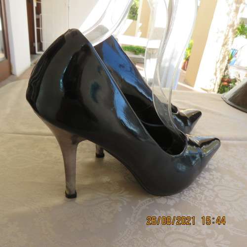 Pair sharp pointed black pumps with patent leather look and silver stiletto heels.By INWEAR size 7.