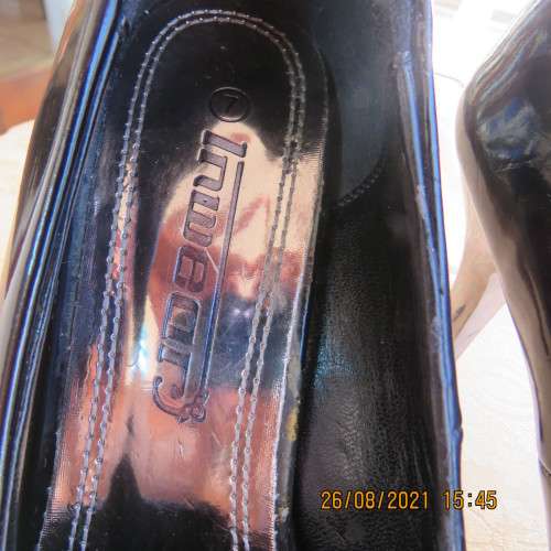 Pair sharp pointed black pumps with patent leather look and silver stiletto heels.By INWEAR size 7.