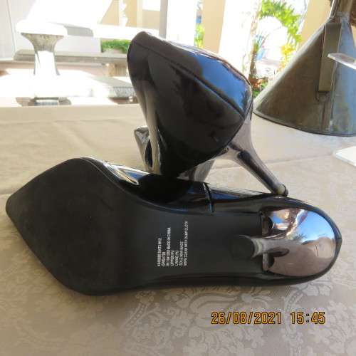 Pair sharp pointed black pumps with patent leather look and silver stiletto heels.By INWEAR size 7.