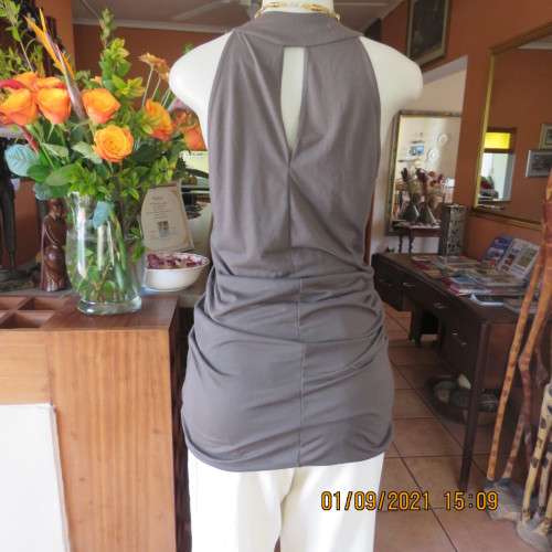 Sexy long dark olive green top by LEGIT 34/10.Vertical cotton band on front with stud decoration