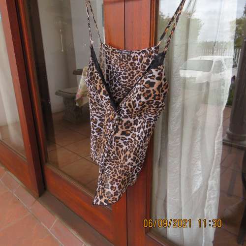 Animal print sexy top by RT Denim, size 30/6, adjustable thin straps, fold over bust