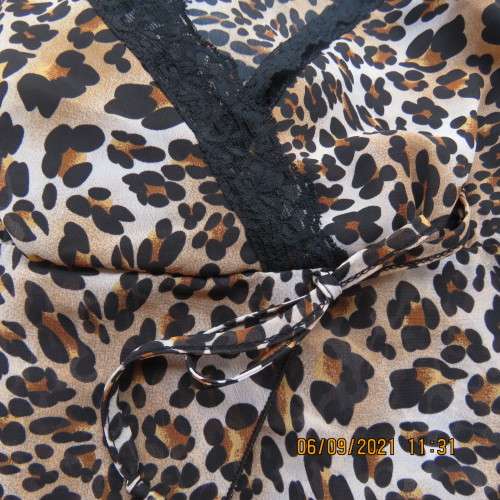 Animal print sexy top by RT Denim, size 30/6, adjustable thin straps, fold over bust