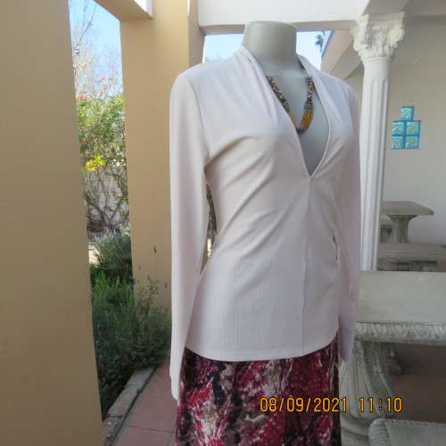 Top of the line rich cream long sleeve sexy top by H+M size 36/12. Made in Turkey. In new condition.