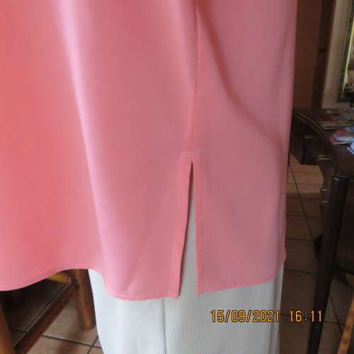 Summer fresh paw-paw colour button down top. Size 42/18. In 100% wash+wear polyester fabric. As new