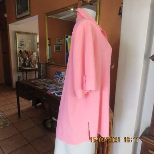Summer fresh paw-paw colour button down top. Size 42/18. In 100% wash+wear polyester fabric. As new