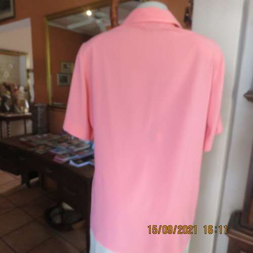 Summer fresh paw-paw colour button down top. Size 42/18. In 100% wash+wear polyester fabric. As new
