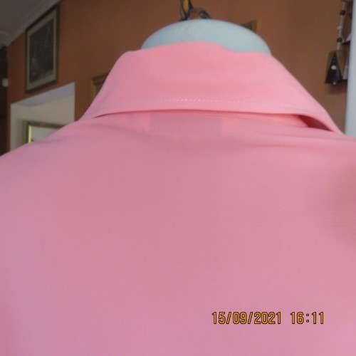 Summer fresh paw-paw colour button down top. Size 42/18. In 100% wash+wear polyester fabric. As new