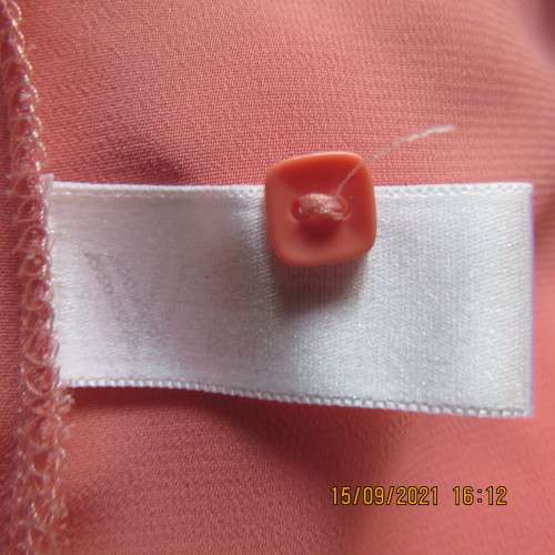 Summer fresh paw-paw colour button down top. Size 42/18. In 100% wash+wear polyester fabric. As new