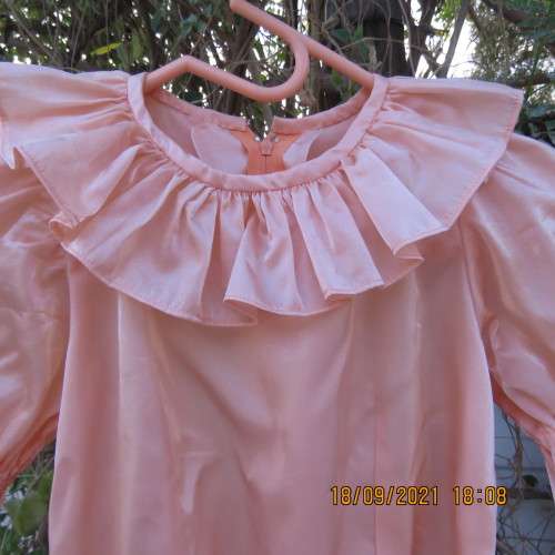 Shiny peach satin puffed short sleeve dress for 11-12 year old girl. Suitable for special occasion.