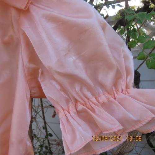 Shiny peach satin puffed short sleeve dress for 11-12 year old girl. Suitable for special occasion.