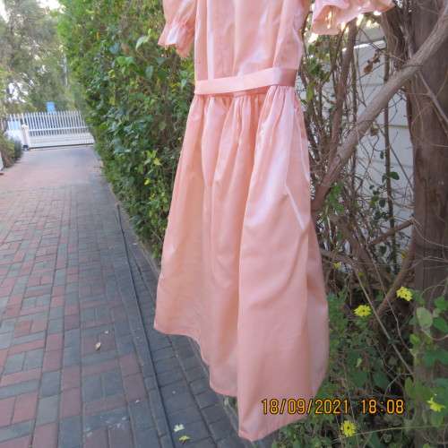 Shiny peach satin puffed short sleeve dress for 11-12 year old girl. Suitable for special occasion.