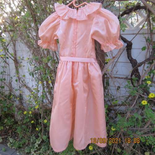 Shiny peach satin puffed short sleeve dress for 11-12 year old girl. Suitable for special occasion.