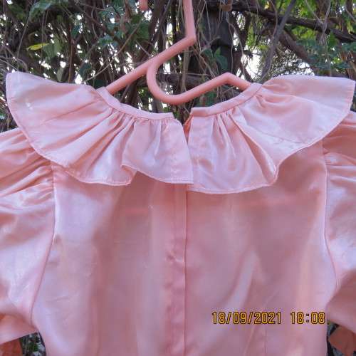 Shiny peach satin puffed short sleeve dress for 11-12 year old girl. Suitable for special occasion.