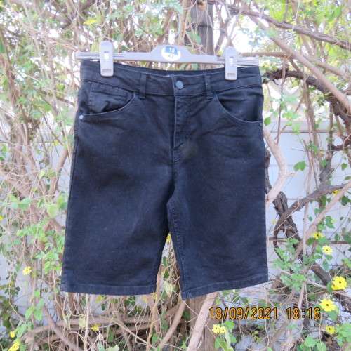 Boy`s black stretch knee length denim shorts. By RT for boy 13-14 years. Pockets back+front. As new.