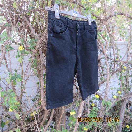 Boy`s black stretch knee length denim shorts. By RT for boy 13-14 years. Pockets back+front. As new.