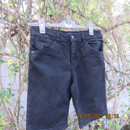 Boy`s black stretch knee length denim shorts. By RT for boy 13-14 years. Pockets back+front. As new.