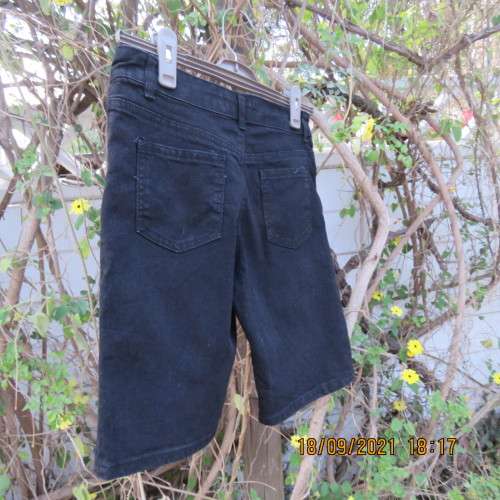 Boy`s black stretch knee length denim shorts. By RT for boy 13-14 years. Pockets back+front. As new.
