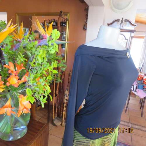 Hot black off the shoulder top by H+M size 32/8. Fold over collar. Poly stretch fabric. As new.