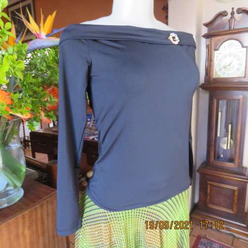 Hot black off the shoulder top by H+M size 32/8. Fold over collar. Poly stretch fabric. As new.