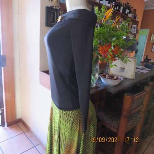 Hot black off the shoulder top by H+M size 32/8. Fold over collar. Poly stretch fabric. As new.