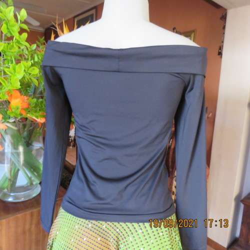 Hot black off the shoulder top by H+M size 32/8. Fold over collar. Poly stretch fabric. As new.
