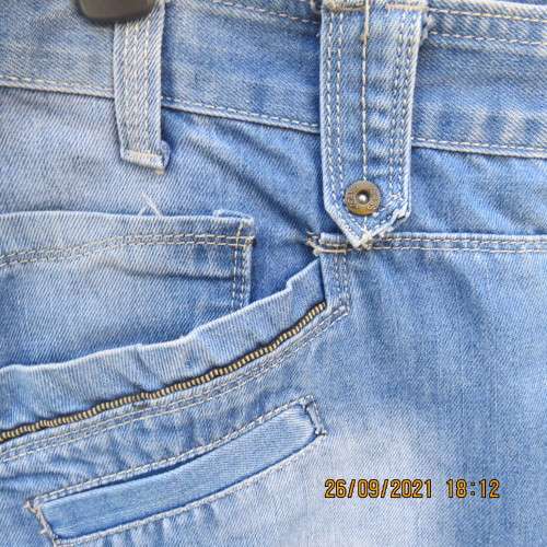 Men`s fashion blue distressed jeans with unique pockets galore size 34 by COSITA.Good condition.