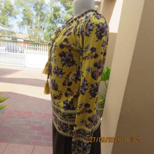 Feminine mustard yellow off the shoulder long sleeve top with crimson.maroon flowers.Size 32 to 34.