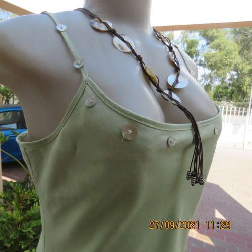 Go feminine in this apple green strappy fully lined dress.Size 36/12 by DEFINE.In linen/cotton blend