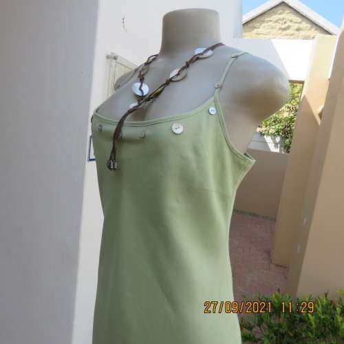 Go feminine in this apple green strappy fully lined dress.Size 36/12 by DEFINE.In linen/cotton blend