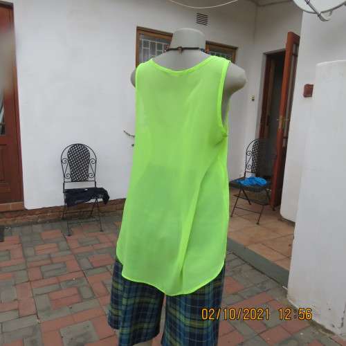 Sheer neon yellowgreen loose hanging sleeveless top. Slip over with scooped neckline. Size 38/14.