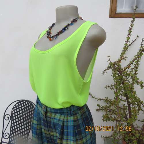 Sheer neon yellowgreen loose hanging sleeveless top. Slip over with scooped neckline. Size 38/14.