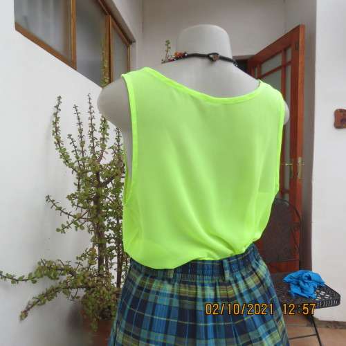 Sheer neon yellowgreen loose hanging sleeveless top. Slip over with scooped neckline. Size 38/14.