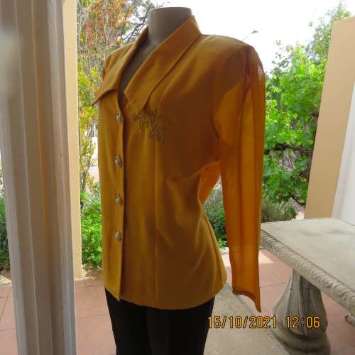 Fabulous mustard colour button down top by MERIEN HALL size 40/16.Sheer long sleeves.Buttons at back