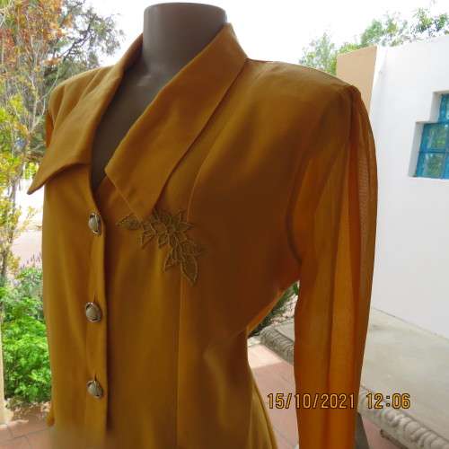 Fabulous mustard colour button down top by MERIEN HALL size 40/16.Sheer long sleeves.Buttons at back