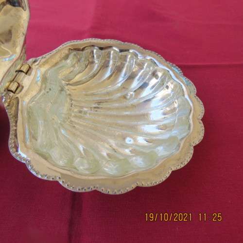 Beautiful antique silverplated open shell look butter dish with glass dish insize.13cm x 13cm.As new