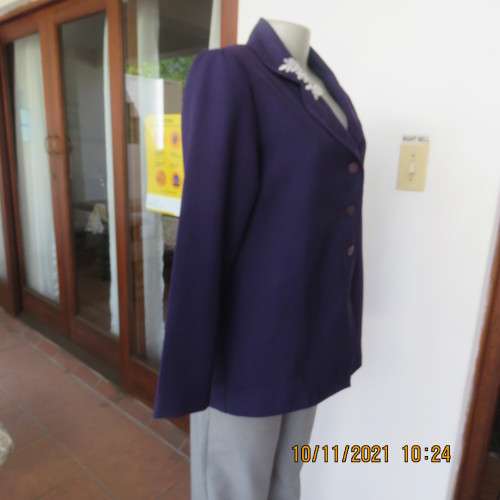 Smart boutique made purple long sleeve jacket.Four button closure with cloverleaf collar.Size 36.