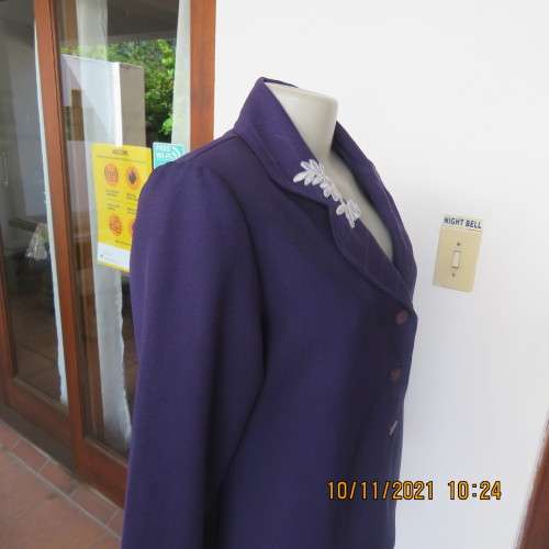 Smart boutique made purple long sleeve jacket.Four button closure with cloverleaf collar.Size 36.