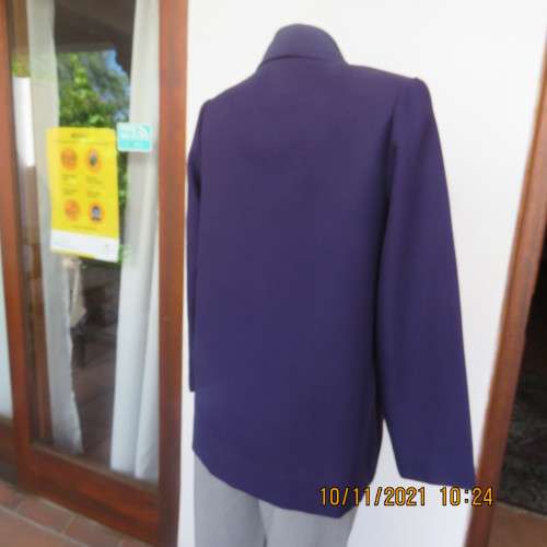 Smart boutique made purple long sleeve jacket.Four button closure with cloverleaf collar.Size 36.