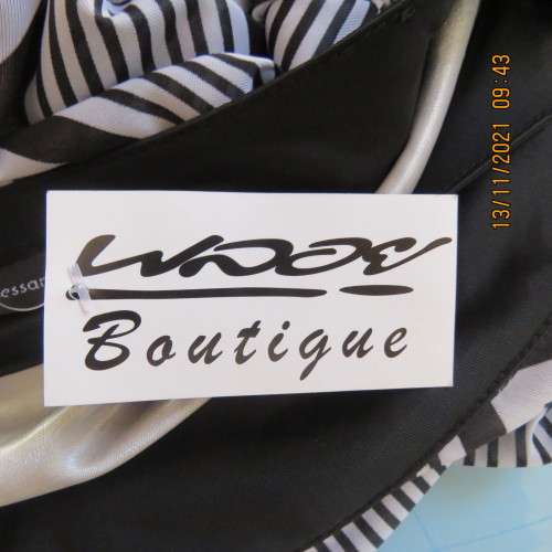 Stunning new short sleeve monochrome empire waist dress in soft silky 2 layer polyester.Size 32/8