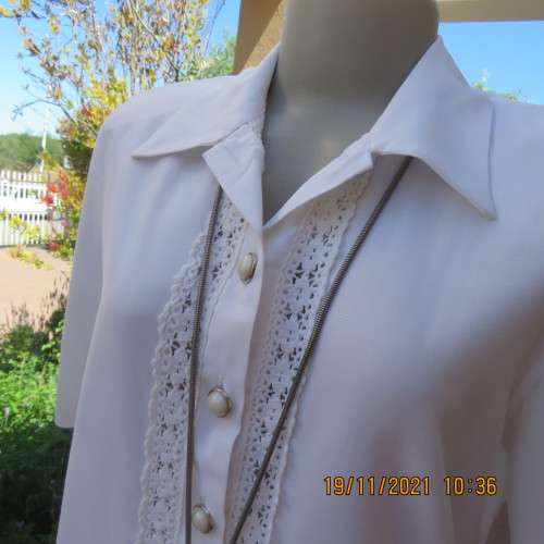 Beautiful short sleeve button down white top with cotton lace both sides.Size 36/12.Shirt collar.